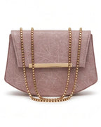 Pink handbag with gold chain strap on a white background