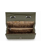 Green handbag with paisley pattern interior on a white background