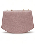 Pink handbag with geometric pattern on a white background