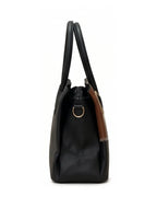Black handbag with brown accents on a white background