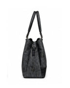 Black shoulder bag with a strap on a white background