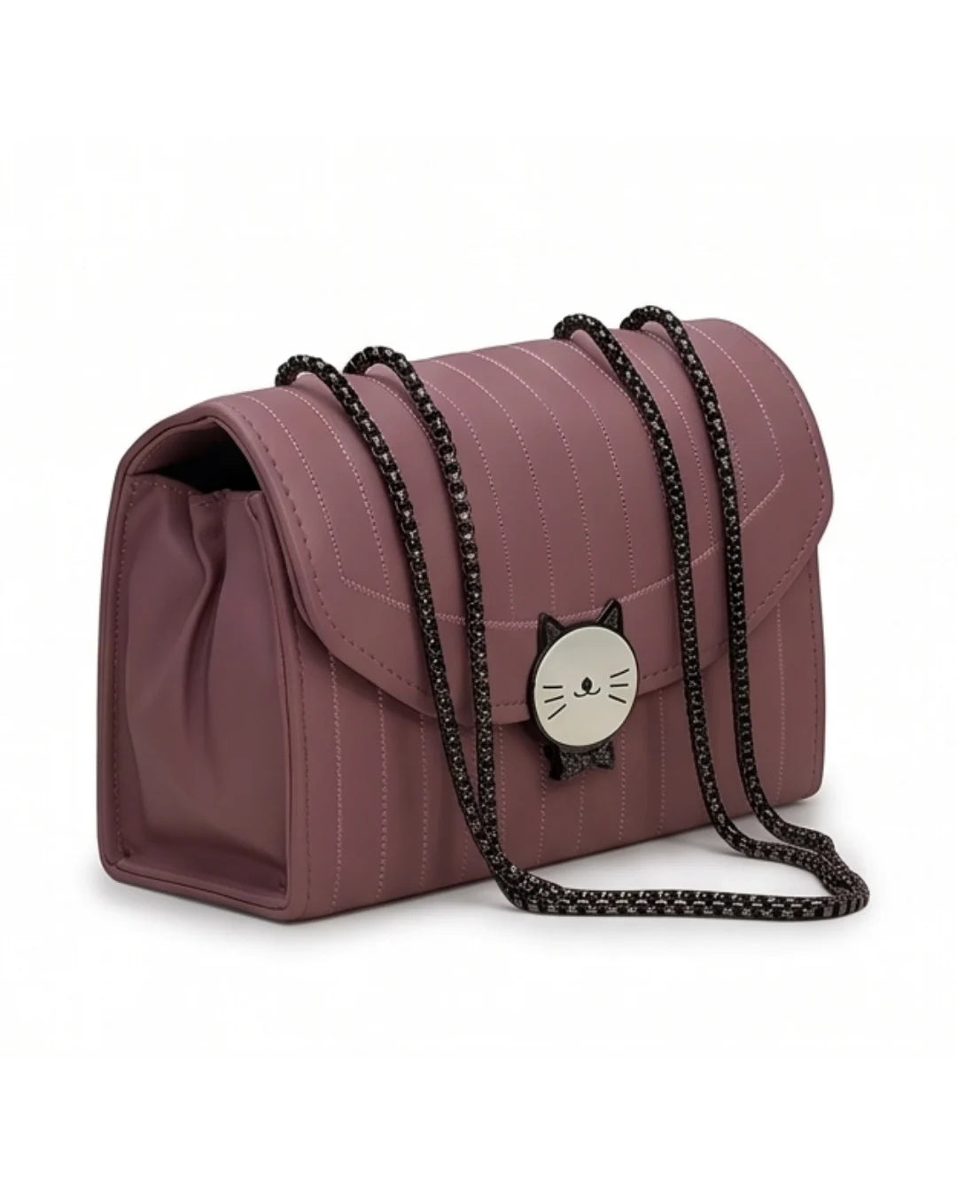 Pink handbag with a cat-shaped charm on a white background