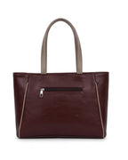 Brown leather handbag with a visible zipper on a white background