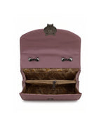 Pink leather clutch bag with floral interior on a white background