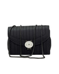 Black quilted handbag with a chain strap on a white background