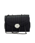 Black quilted handbag with a chain strap on a white background
