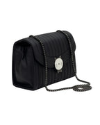 Black quilted handbag with chain strap on a white background