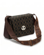 Patterned shoulder bag with a skull design on a white background