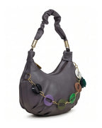 Gray handbag with colorful accents on a white background