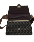 Patterned bag with a brown strap on a white background