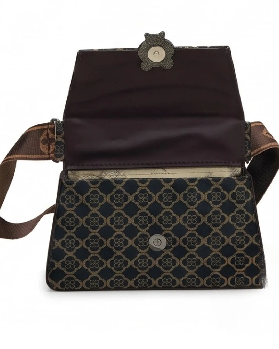 Patterned bag with a brown strap on a white background