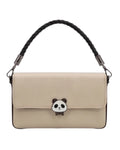 Beige handbag with a panda charm on a white background