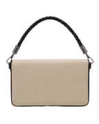 Beige handbag with a black braided handle on a white background