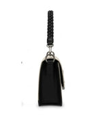 Black handbag with a braided handle on a white background