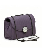 Purple handbag with a cat face emblem on a white background