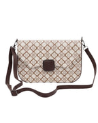 Patterned shoulder bag with a brown buckle on a white background