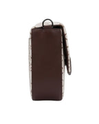 Brown and white patterned backpack on a white background