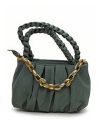 Green handbag with braided handle and gold chain detail on a white background