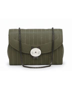 Green handbag with cat face emblem on a white background
