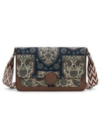 Patterned shoulder bag with a brown flap on a white background