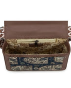 Patterned bag with a brown flap on a white background