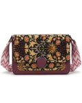 Floral patterned crossbody bag with a colorful strap on a white background