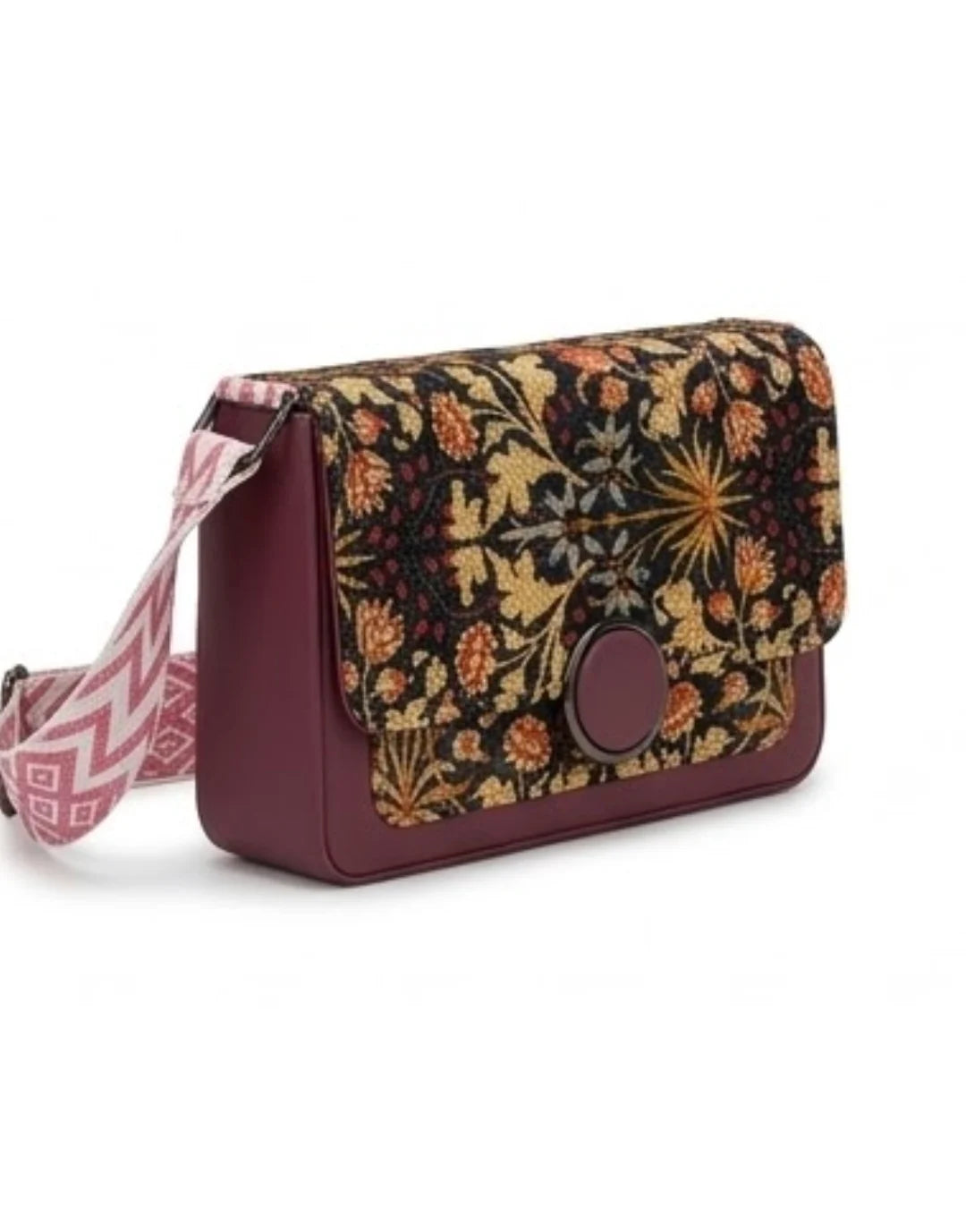 Floral patterned crossbody bag with a strap on a white background