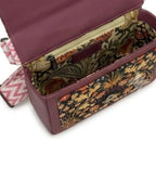 Purple fabric box with floral pattern on a white background