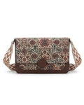 Floral patterned crossbody bag with a brown strap on a white background