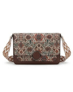 Floral patterned crossbody bag with a brown strap on a white background