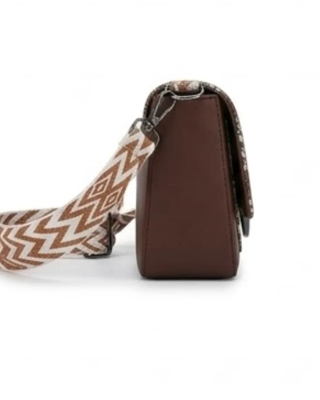 Brown leather bag with a patterned strap on a white background