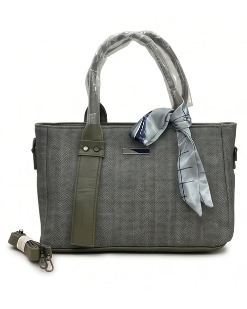 Gray handbag with a green strap and a gray scarf on a white background