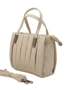 Beige top handle designer bag with elegant pleated texture and metallic accents

