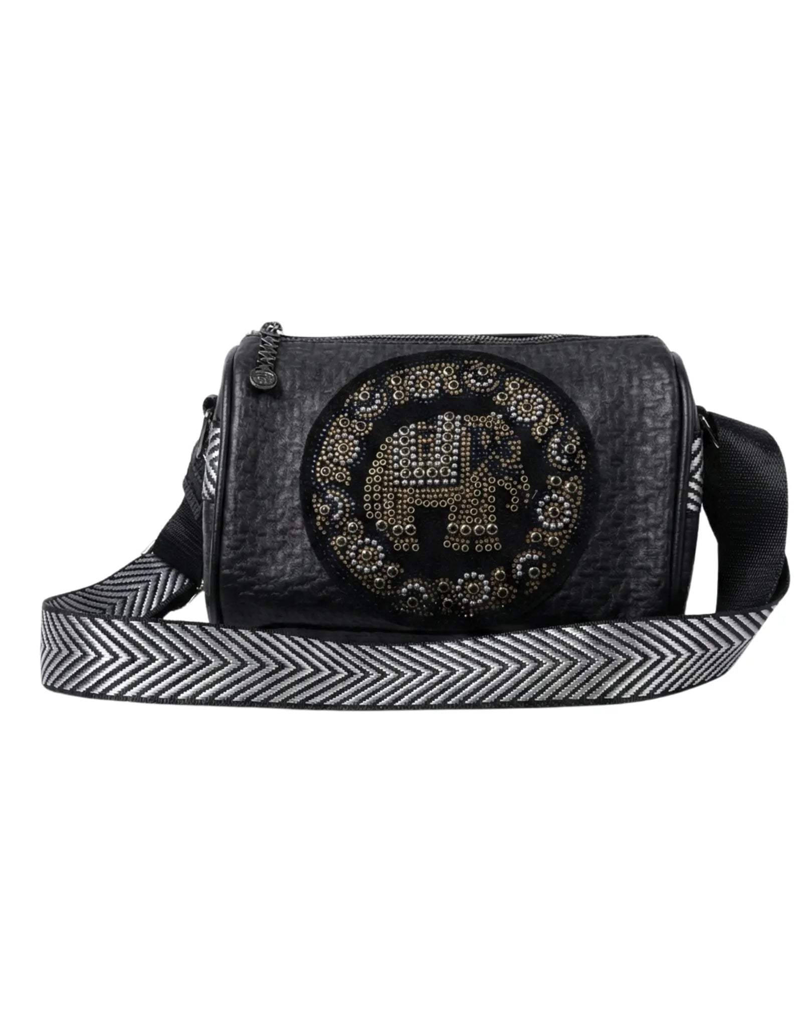 Black crossbody bag with decorative emblem and striped strap on a white background
