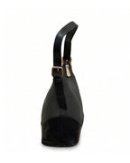 Black handbag with a gold buckle on a white background