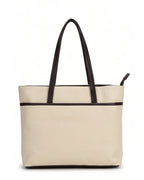 Beige tote bag with black handles on a white background