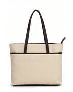 Beige tote bag with black handles on a white background