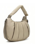 Beige handbag with a textured surface on a white background