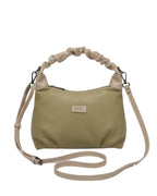 Beige handbag with a strap on a white background