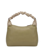 Beige handbag with a textured handle on a white background