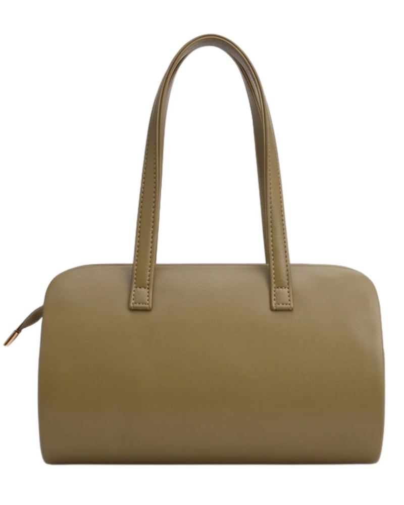 Green handbag with a strap on a white background