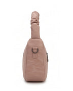 Beige sling bag on a white background