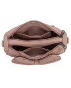 Pink handbag with multiple zippers on a white background