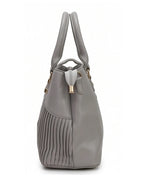 Gray handbag with pleated design on a white background