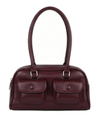 Maroon handbag with two front pockets on a white background