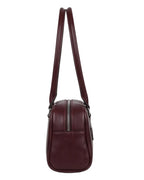 Maroon leather handbag with a shoulder strap on a white background