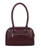 Maroon handbag with a silver zipper on a white background