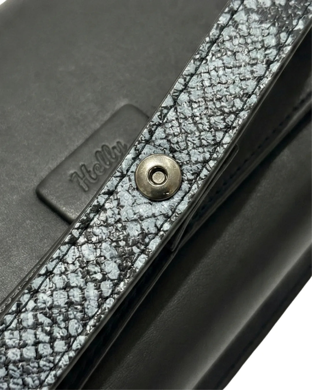 Sleek black clutch purse and formal clutch bag with textured edge detailing
