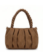 Brown handbag with braided handle on a white background