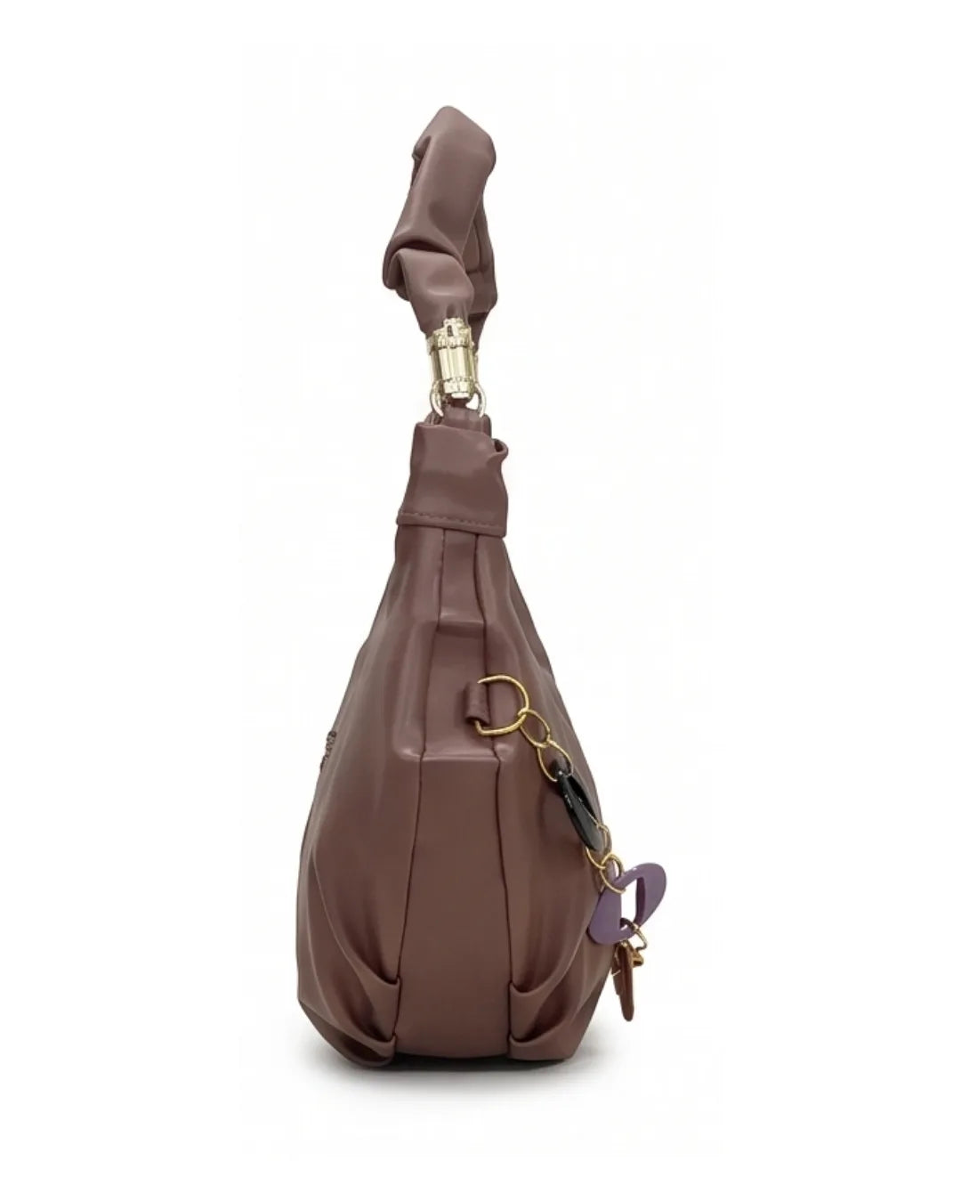 Brown leather sling bag with keychain on a white background